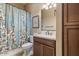 Charming bathroom with a shower/tub combo and updated vanity at 578 E Laddoos Ave, San Tan Valley, AZ 85140