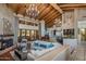 Spacious living room features hardwood floors, a large sectional sofa, and a stunning chandelier at 8530 E Via Montoya --, Scottsdale, AZ 85255