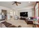 Gathering room with a large TV, comfortable seating, and access to other rooms at 3660 S Golden Eye Ln, Gold Canyon, AZ 85118