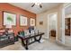 Spacious home office with desk, built-in shelving and access to a full bathroom at 3660 S Golden Eye Ln, Gold Canyon, AZ 85118