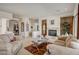 Open living room with cozy seating and a view to the entryway at 3660 S Golden Eye Ln, Gold Canyon, AZ 85118