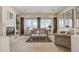 Spacious living room with large windows, fireplace, and comfortable seating at 3660 S Golden Eye Ln, Gold Canyon, AZ 85118