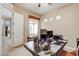 Home office with ample workspace and natural light from a large window at 3660 S Golden Eye Ln, Gold Canyon, AZ 85118