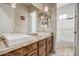 Clean bathroom with double vanity and a separate tub and shower at 3660 S Golden Eye Ln, Gold Canyon, AZ 85118
