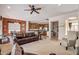 Spacious living room with leather sofas and a view into the kitchen at 3660 S Golden Eye Ln, Gold Canyon, AZ 85118