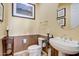 Elegant powder room with pedestal sink and decorative accents at 3660 S Golden Eye Ln, Gold Canyon, AZ 85118