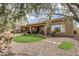 Backyard with putting green, patio, and mature trees at 3660 S Golden Eye Ln, Gold Canyon, AZ 85118