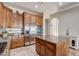 Gourmet kitchen featuring stainless steel appliances and large granite island at 3660 S Golden Eye Ln, Gold Canyon, AZ 85118