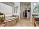 Spa-like bathroom with soaking tub, walk-in shower, and double vanity at 3660 S Golden Eye Ln, Gold Canyon, AZ 85118