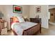 Bright bedroom with wood bed frame and decorative pillows at 3660 S Golden Eye Ln, Gold Canyon, AZ 85118