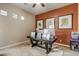 Bright home office features a large desk, built-in shelving and an accent wall at 3660 S Golden Eye Ln, Gold Canyon, AZ 85118