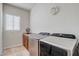 Convenient laundry room with modern washer and dryer, and ample counter space at 3660 S Golden Eye Ln, Gold Canyon, AZ 85118