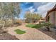 Landscaped backyard with putting green and gravel at 3660 S Golden Eye Ln, Gold Canyon, AZ 85118