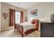 Cozy bedroom with wood bed frame and window coverings at 3660 S Golden Eye Ln, Gold Canyon, AZ 85118