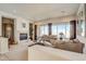 Bright living room featuring a fireplace and ample natural light at 3660 S Golden Eye Ln, Gold Canyon, AZ 85118