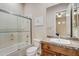 Clean bathroom with a shower/tub combo, wood vanity and tile flooring at 3660 S Golden Eye Ln, Gold Canyon, AZ 85118