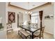 Elegant dining room featuring a dark wood table and neutral decor at 3660 S Golden Eye Ln, Gold Canyon, AZ 85118