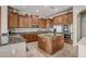 Kitchen with granite countertops, wooden cabinets, and a large island at 3660 S Golden Eye Ln, Gold Canyon, AZ 85118