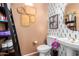 Stylish bathroom with unique wall decor and double vanity at 2529 W Florentine Rd, Phoenix, AZ 85086