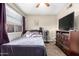 Simple bedroom with ceiling fan and neutral color scheme at 1601 W Sunnyside Dr # 154, Phoenix, AZ 85029