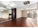 Spacious living room with hardwood floors and a large mirror at 1601 W Sunnyside Dr # 154, Phoenix, AZ 85029