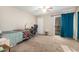 Bright bedroom with a desk and sliding mirrored closet at 1601 W Sunnyside Dr # 154, Phoenix, AZ 85029
