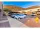 Parking lot with covered spaces and mountain views at 1601 W Sunnyside Dr # 154, Phoenix, AZ 85029