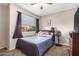 Cozy bedroom with neutral decor and ceiling fan at 1601 W Sunnyside Dr # 154, Phoenix, AZ 85029