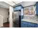 Kitchen boasts stainless steel appliances and blue cabinets at 1601 W Sunnyside Dr # 154, Phoenix, AZ 85029