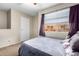 Bright bedroom featuring neutral walls and a ceiling fan at 1601 W Sunnyside Dr # 154, Phoenix, AZ 85029