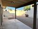 Covered patio and gravel backyard with small plants at 7006 E Jensen St # 83, Mesa, AZ 85207