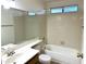 Bathroom with bathtub, single sink, and tiled walls at 7006 E Jensen St # 83, Mesa, AZ 85207