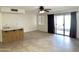 Living room with tile floors, sliding glass doors, and a wet bar at 7006 E Jensen St # 83, Mesa, AZ 85207