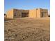 Newly built home with stucco exterior, attached garage, and desert landscaping at 38422 W Buckeye Rd, Tonopah, AZ 85354