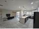 Open concept kitchen and living area with island at 38422 W Buckeye Rd, Tonopah, AZ 85354