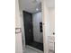 Modern bathroom with a large walk-in shower, featuring marble and hexagon tile at 38422 W Buckeye Rd, Tonopah, AZ 85354