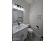 Modern bathroom with white vanity, gold fixtures, and gray floor at 38422 W Buckeye Rd, Tonopah, AZ 85354