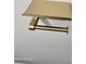 Close-up of gold-toned toilet paper holder and shelf at 38422 W Buckeye Rd, Tonopah, AZ 85354