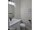 Modern bathroom with white vanity, gold fixtures, and gray floor at 38422 W Buckeye Rd, Tonopah, AZ 85354