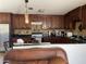 Modern kitchen with dark wood cabinets and granite countertops at 1618 N 52Nd Dr, Phoenix, AZ 85035