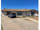 Ranch-style house with a driveway and a spacious yard at 1618 N 52Nd Dr, Phoenix, AZ 85035