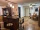 Kitchen with breakfast bar, dining area, and tile floors at 1618 N 52Nd Dr, Phoenix, AZ 85035