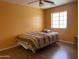 Bedroom with wood flooring, ceiling fan and large window at 1129 E Love St, Casa Grande, AZ 85122