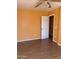 Spacious bedroom with wood flooring and ceiling fan at 1129 E Love St, Casa Grande, AZ 85122