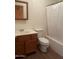 Clean bathroom with tub, shower, and wood vanity at 1129 E Love St, Casa Grande, AZ 85122