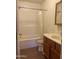 Clean bathroom with tub, shower, and wood vanity at 1129 E Love St, Casa Grande, AZ 85122