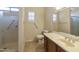 Bathroom with shower, toilet and a large vanity with mirror at 19051 N Aztec Point Dr, Surprise, AZ 85387
