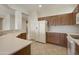 Modern kitchen with white appliances and wood cabinets at 19051 N Aztec Point Dr, Surprise, AZ 85387