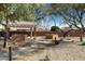 Community area with a pergola, built-in grill, and seating at 19051 N Aztec Point Dr, Surprise, AZ 85387