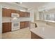Kitchen with wood cabinets and tile flooring at 19051 N Aztec Point Dr, Surprise, AZ 85387
